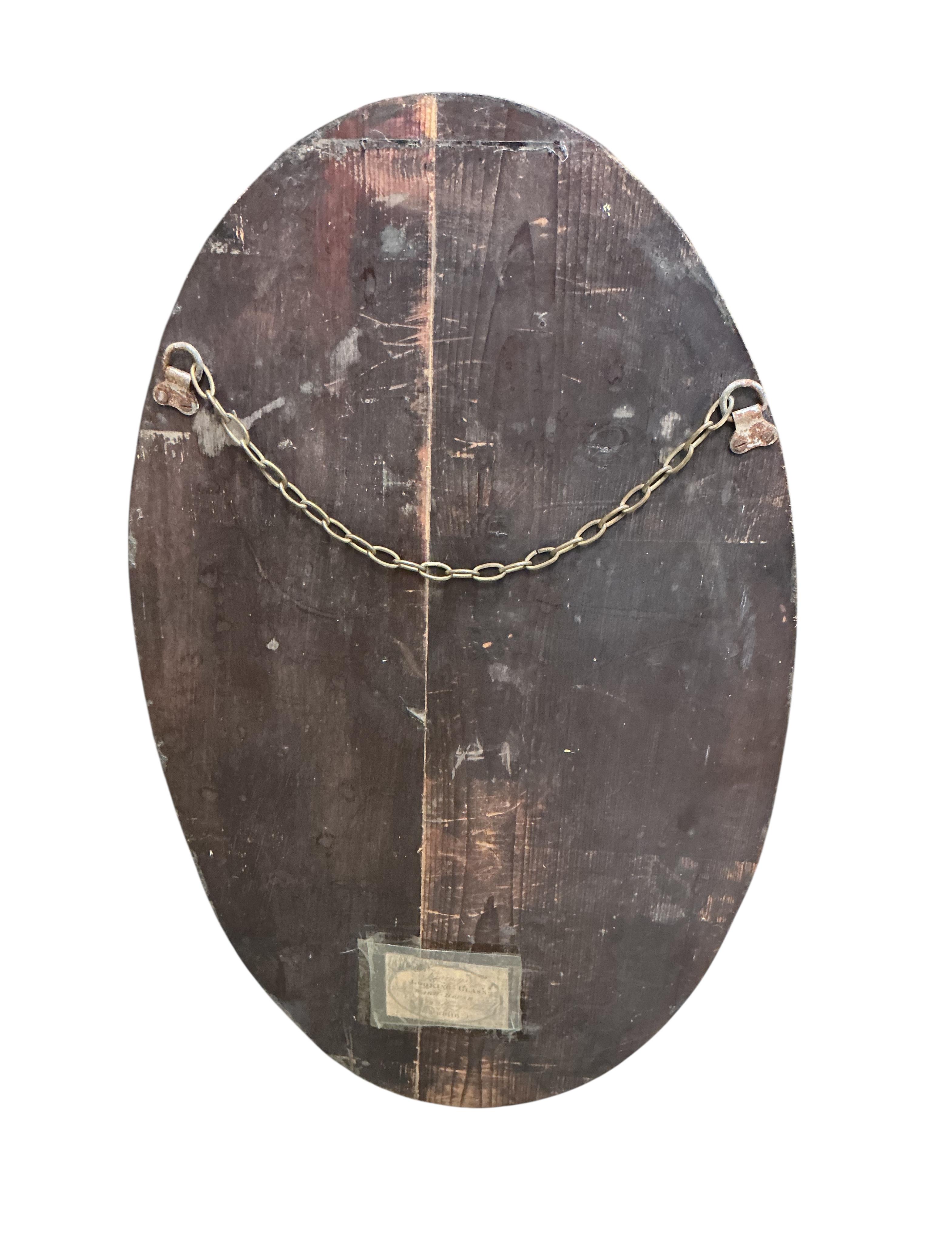 An oval Irish style wall mirror, width 37cm, height 65cm